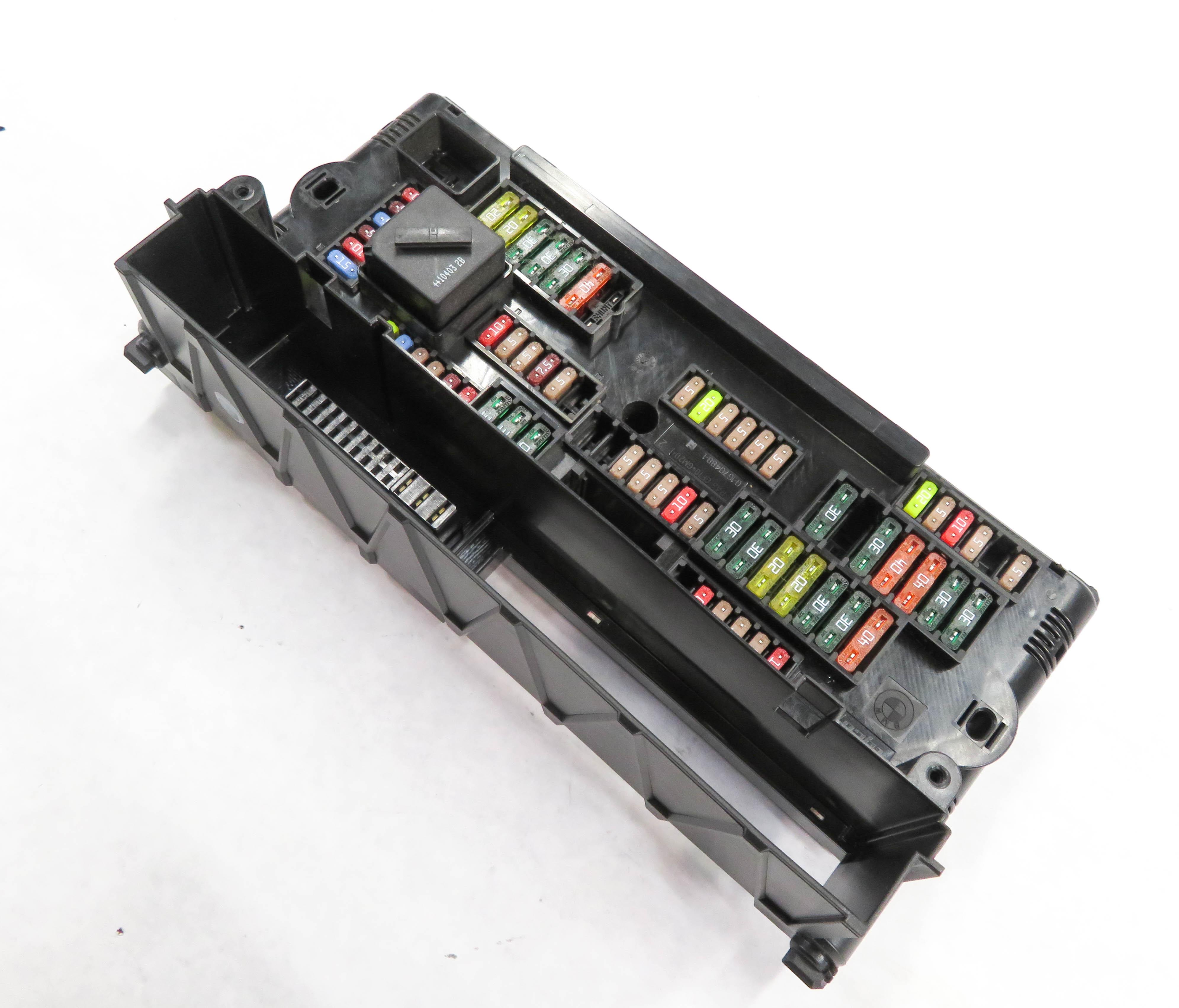 2011 BMW 550iGT (F07) FRONT POWER DISTRIBUTION FUSE BOX RELAY BCM MODULE CRADLE — exact item pictured