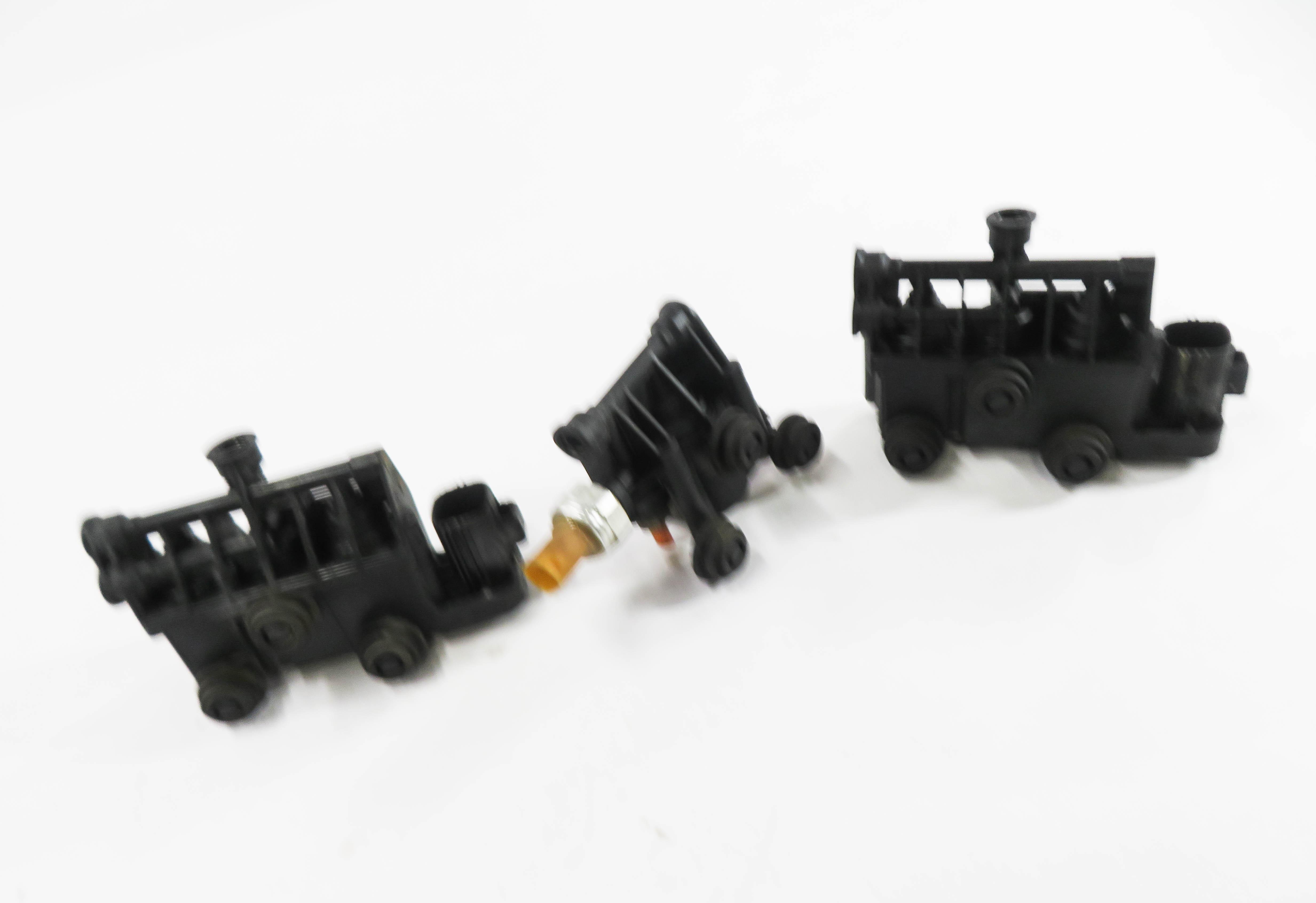 2011 RANGE ROVER SPORT (L320) AIR SUSPENSION TRANSFER RELIEF VALVE BLOCK SET — exact item pictured