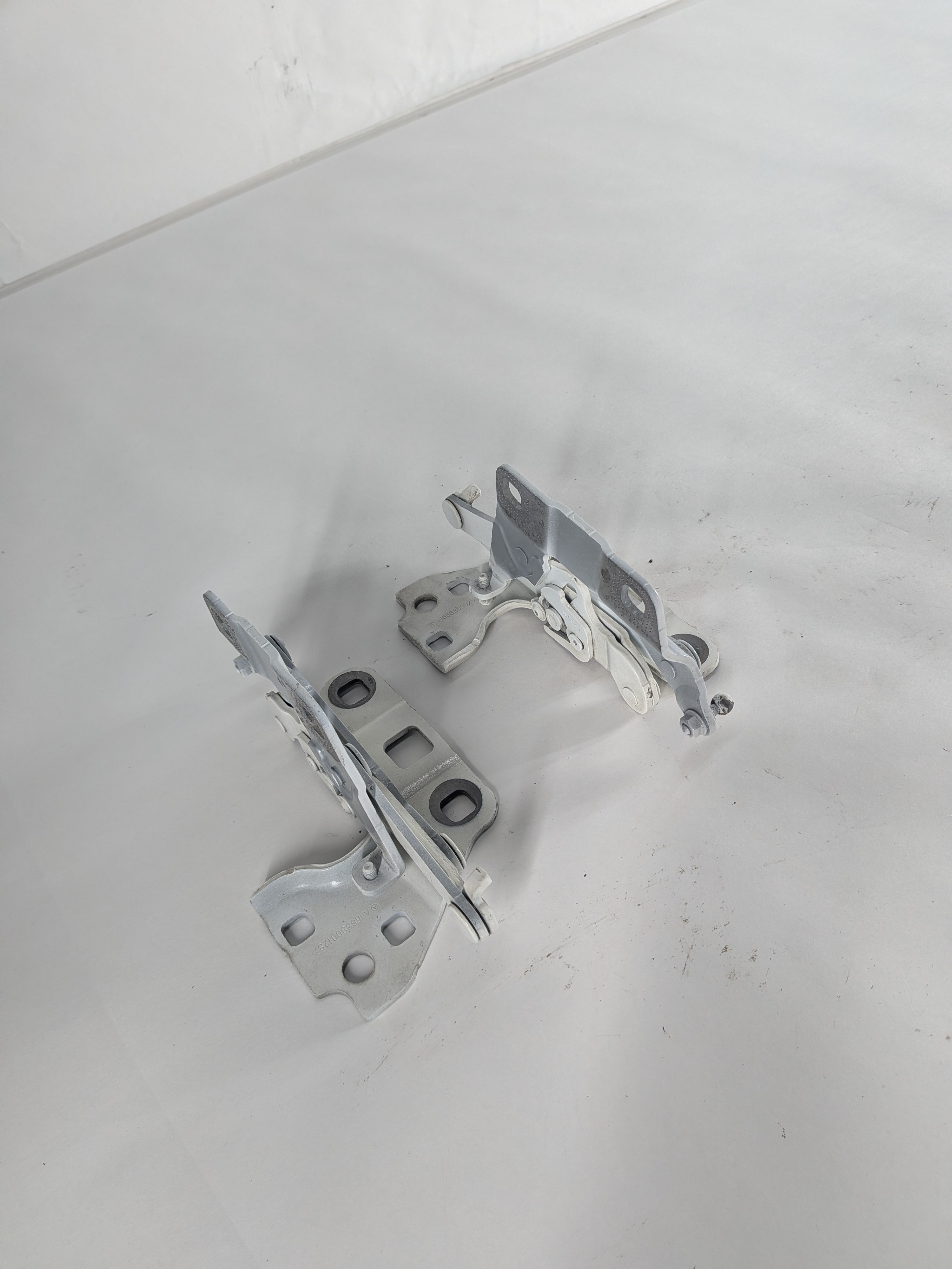 12-19 MERCEDES GL ML (W166 X166) FRONT LEFT & RIGHT HOOD HINGE SET (White) — exact item pictured